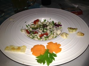 Ceviche - a mix of fish, shrimps, red peppers, onions and cilantro - all marinated in lime juice.